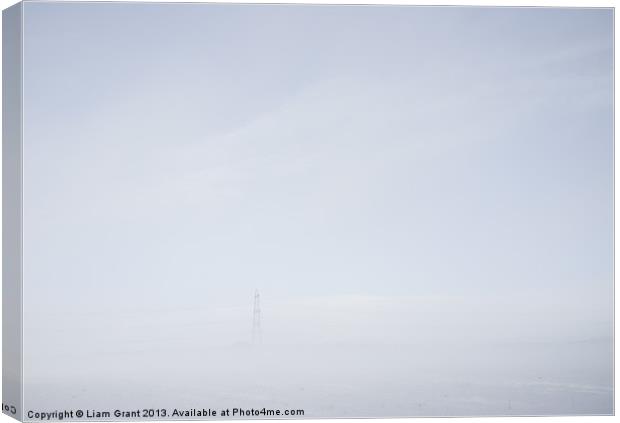 Electricity pylon in freezing fog. Canvas Print by Liam Grant