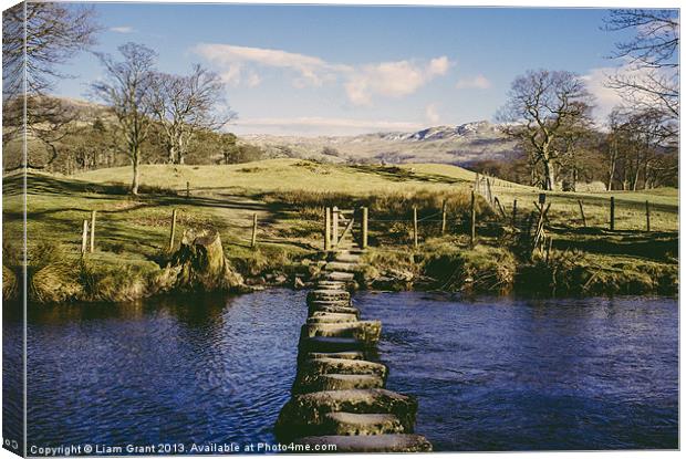Stepping stones over the River Rothay near Amblesi Canvas Print by Liam Grant