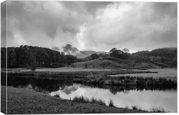 Dramatic sky and reflections on the River Brathay  Canvas Print by Liam Grant