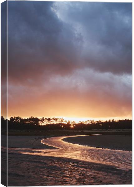 Storm clouds at sunset. Holkham, Norfolk, UK. Canvas Print by Liam Grant