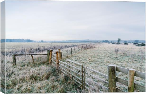 Rural field and gate covered in frost. Norfolk, UK Canvas Print by Liam Grant