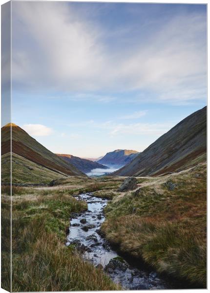 Fog formed in the valley at sunrise. Kirkstone Pas Canvas Print by Liam Grant