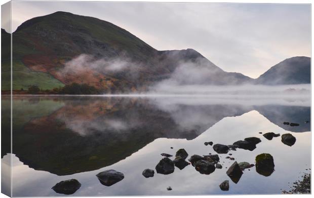 Reflections and fog at sunrise. Brothers Water, Cu Canvas Print by Liam Grant