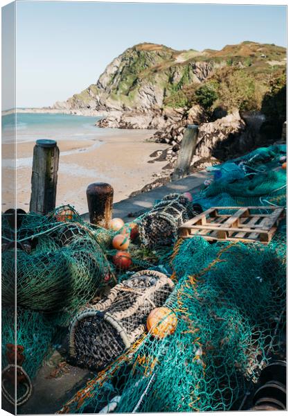 Fishing nets and lobster pots in the harbour at Il Canvas Print by Liam Grant