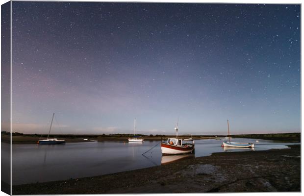 Boats under stars on a moonlit night. Burnham Over Canvas Print by Liam Grant