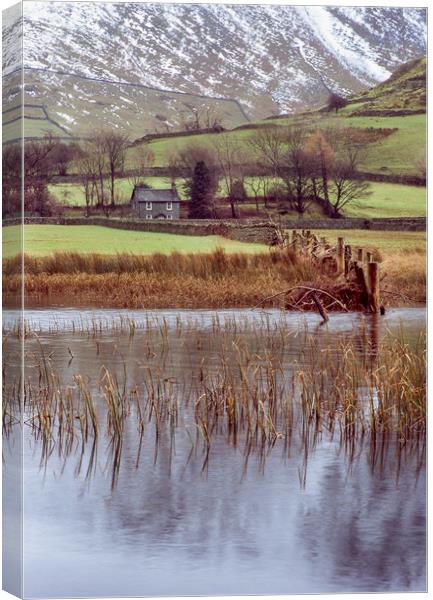 Farm and snow covered mountain reflections in Brot Canvas Print by Liam Grant
