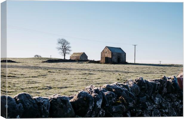 Stone barn in a field on a frosty morning. Derbysh Canvas Print by Liam Grant
