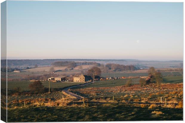 Moon over a farm at sunrise. Derbyshire, UK. Canvas Print by Liam Grant