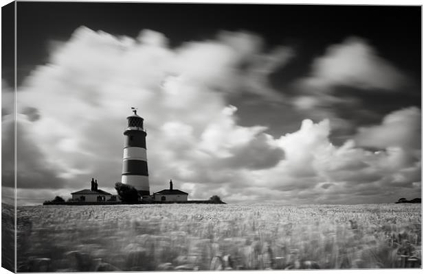 Windswept Happisburgh Lighthouse Canvas Print by Simon Wrigglesworth
