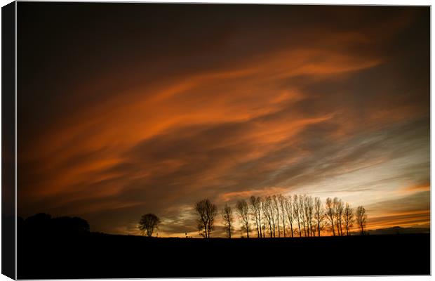 Moody Sunset Canvas Print by Simon Wrigglesworth