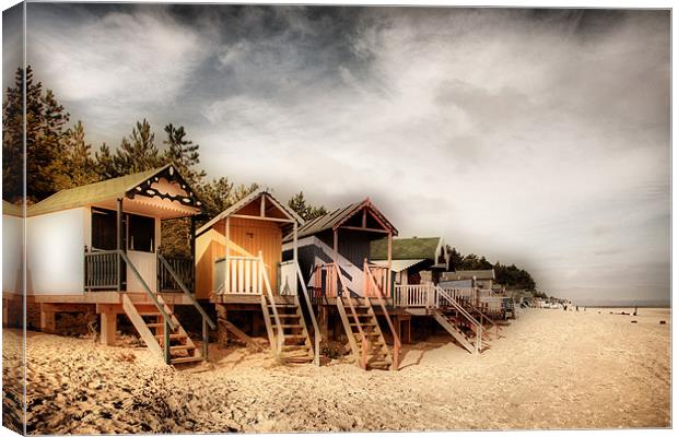 Beach Huts at Wells Canvas Print by Simon Wrigglesworth