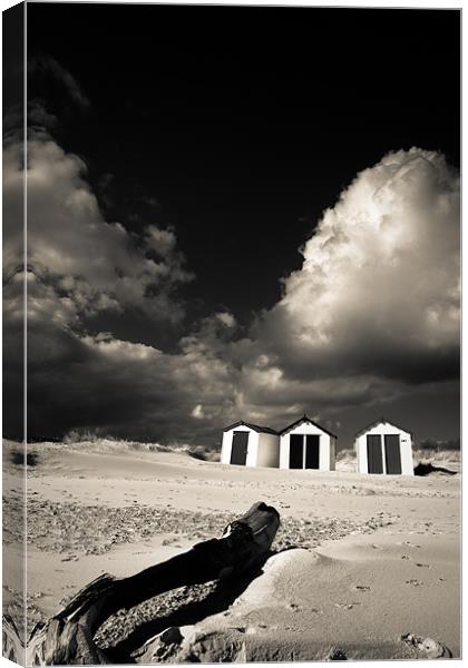 Three beach huts Canvas Print by Simon Wrigglesworth