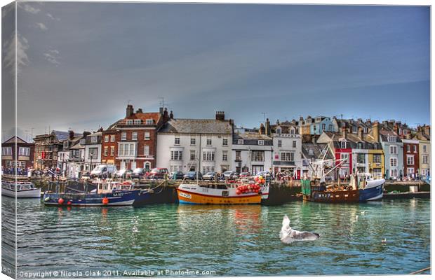 Vibrant Fishing Boats in Weymouth Canvas Print by Nicola Clark