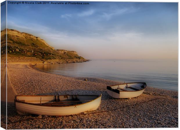 Serene Rowing Boats Amidst Jurassic Coastline Canvas Print by Nicola Clark