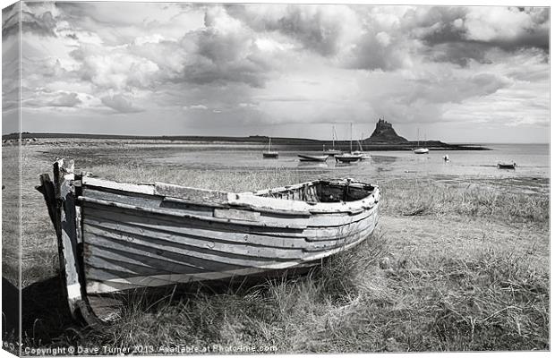 Lindisfarne Castle and Boat Canvas Print by Dave Turner