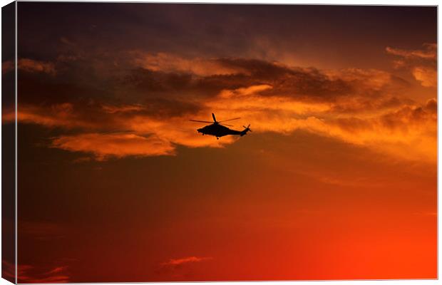 Helicopter At Sunset Canvas Print by Ian Jeffrey