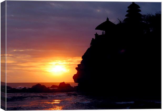 Sunet at Tanah Lot Canvas Print by Nic Christie