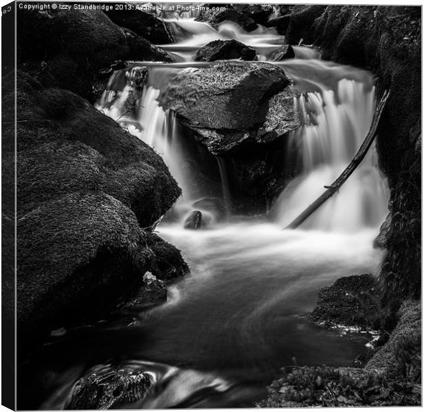 Black and white waterfall over rocks Canvas Print by Izzy Standbridge