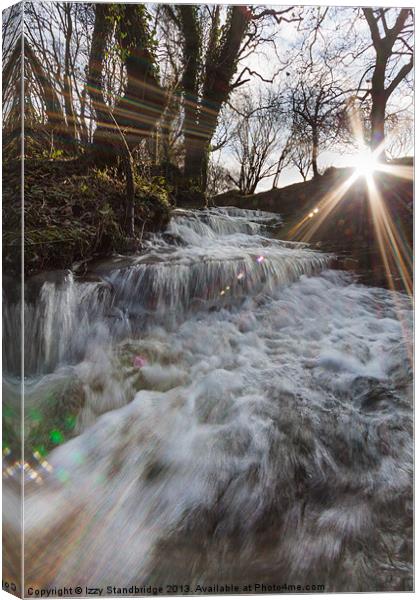 LENS FLARE with gushing stream, winter Canvas Print by Izzy Standbridge