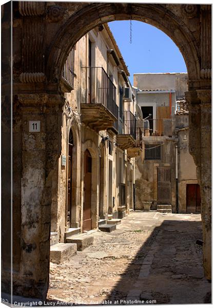 through the arch, Noto Canvas Print by Lucy Antony