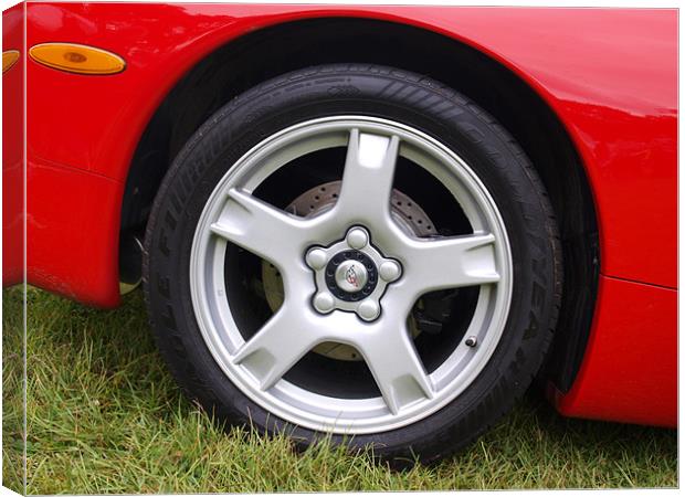 Red Corvette front wheel and wheel arch Canvas Print by Allan Briggs