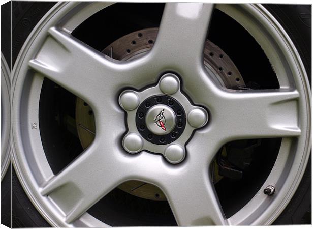 Corvette wheel showing brake disc Canvas Print by Allan Briggs