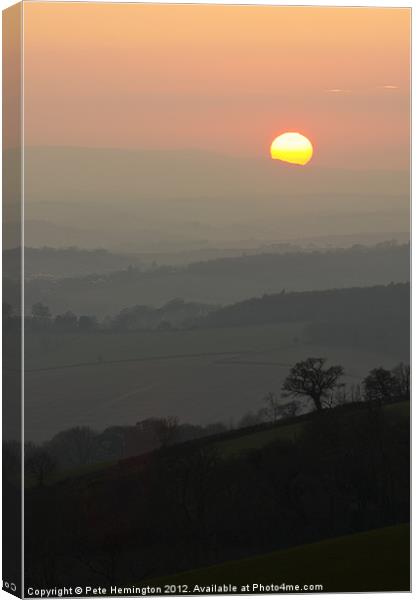 Sunset over the hills Canvas Print by Pete Hemington