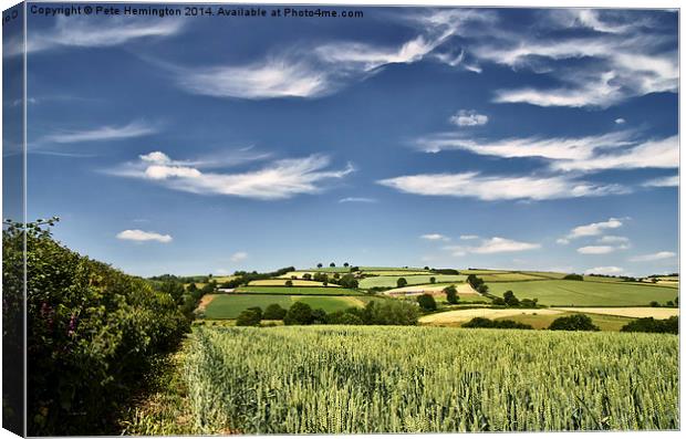 Wispy clouds over caseberry downs Canvas Print by Pete Hemington