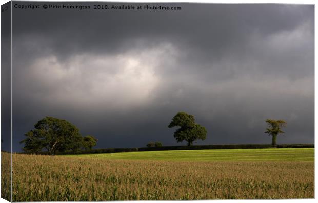 Storm brewing over Devon Canvas Print by Pete Hemington