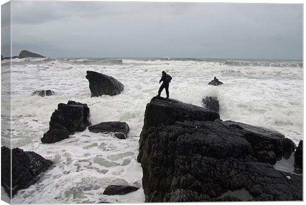 Man braving Waves Canvas Print by Pete Hemington