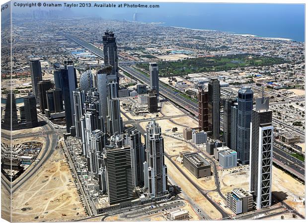 Dubais Majestic Skyscrapers Canvas Print by Graham Taylor