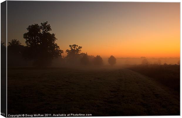 Sunrise and mist Canvas Print by Doug McRae