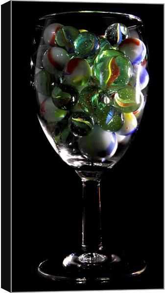 a glass of Marbles Canvas Print by Doug McRae