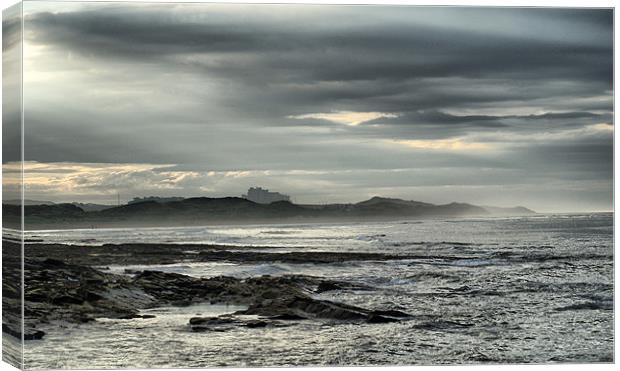 Storm Brewing Over Bamburgh Castle Canvas Print by Sandi-Cockayne ADPS