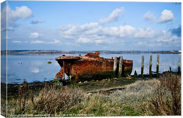 Rusty Wreck on River Medway Canvas Print by Dawn O'Connor