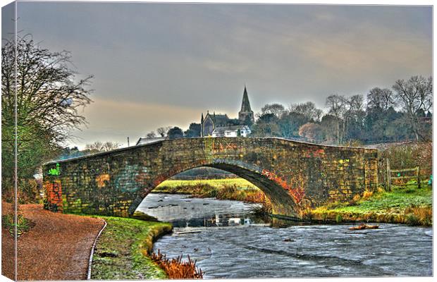 Canal Bridge and Church Steeple, Yorkshire, UK Canvas Print by Dawn O'Connor