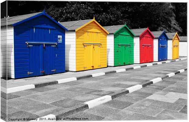 Colourful Beach Huts Canvas Print by Anthony Michael 