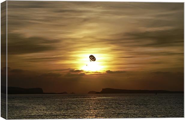 Parasailing at sunset Canvas Print by Sam Smith
