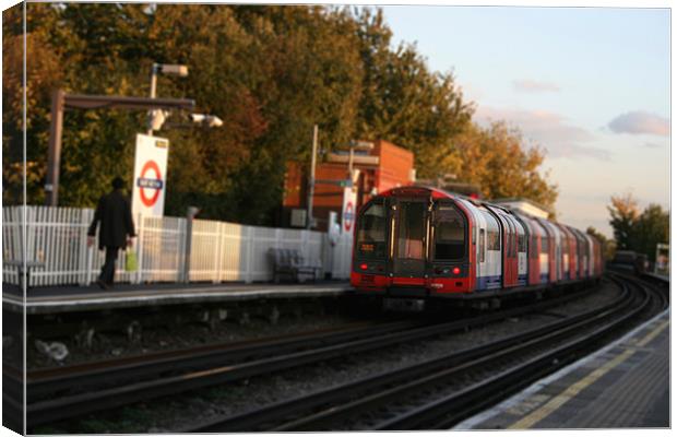 Mini Tube departing station Canvas Print by Will Harnett