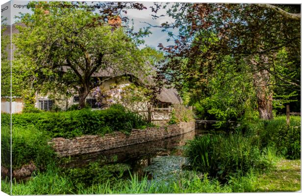 Thatched cottage by the river Lambourn  Canvas Print by Jim Hellier