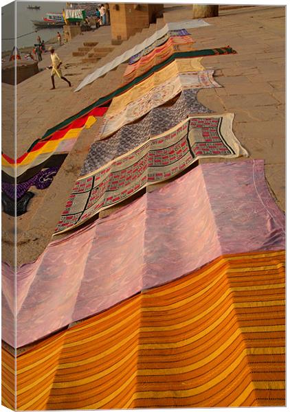Colourful Saris Drying on the Ghats, Varanasi, Ind Canvas Print by Serena Bowles