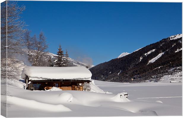 Lonely hut a a snowy lake Canvas Print by Thomas Schaeffer