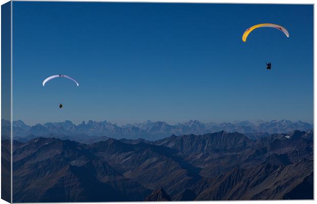 Paragliding over the alps Canvas Print by Thomas Schaeffer