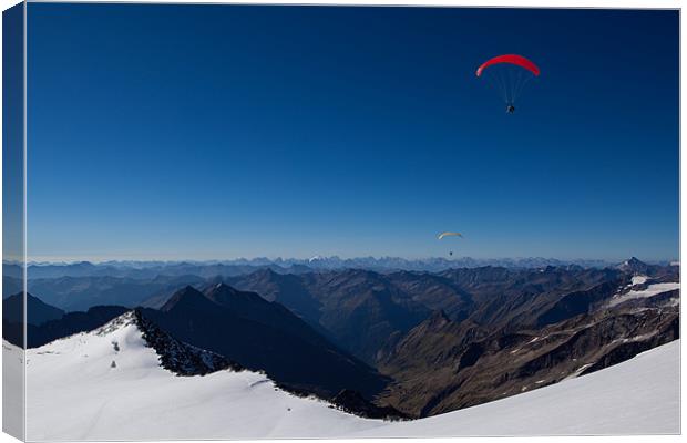 Paraglider over the alps Canvas Print by Thomas Schaeffer