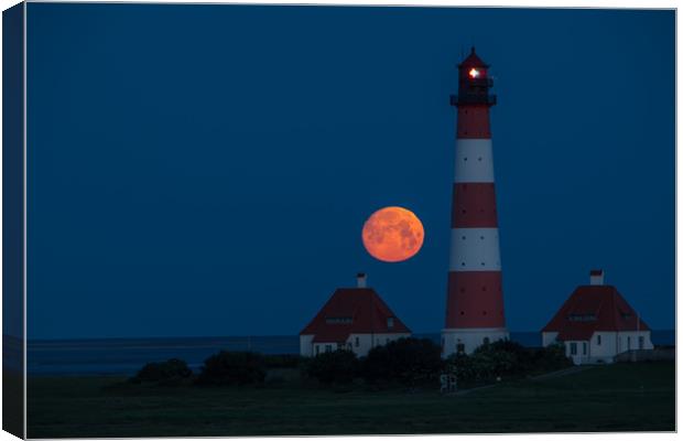 Moonset at Lighthouse in Westerhever Canvas Print by Thomas Schaeffer