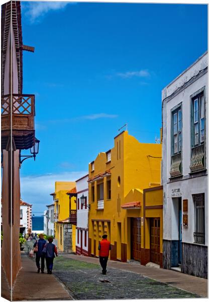 Strolling down the Street in Garachico Canvas Print by Joyce Storey