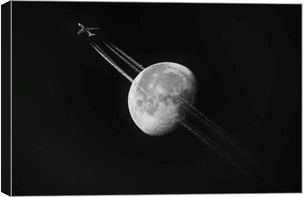 Plane Across the Moon Canvas Print by Paul Appleby
