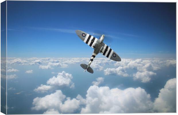 Spitfire In The Clouds Canvas Print by J Biggadike
