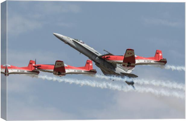 The Swiss Air Force F18 and PC7 Display Team Canvas Print by J Biggadike
