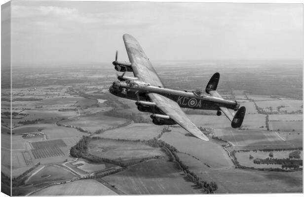 Lincolnshires Lancaster Bomber  Canvas Print by J Biggadike